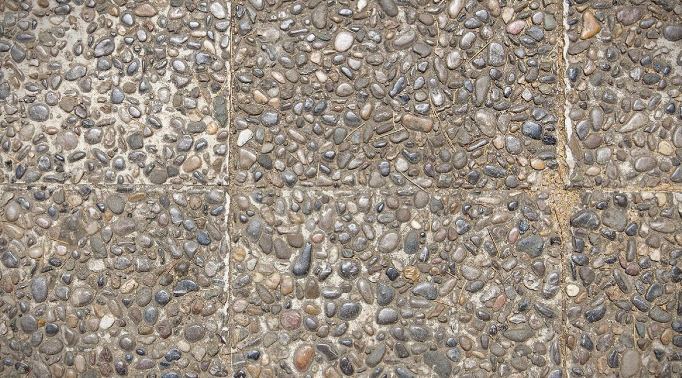 Exposed aggregate concrete surface texture used for walkways and decorative flatwork